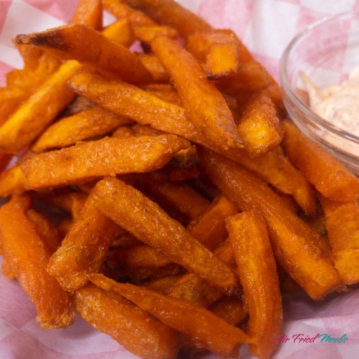 Closeup of a pile of cooked sweet potato fries.